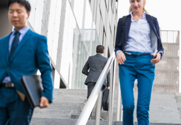 istock Business People Walking On Stairs 1142271081