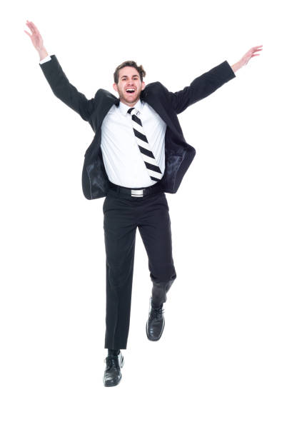 istock Handsome young white male businessman jumping - excitement 1142271084