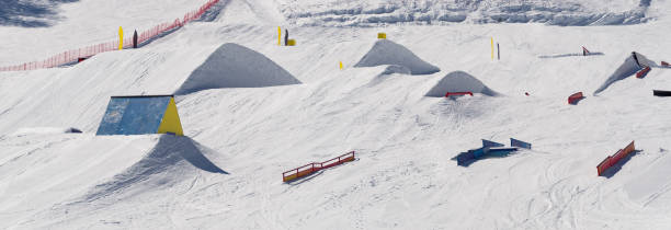 istock Snowpark with ski ramps, kickers, rails 1142271536