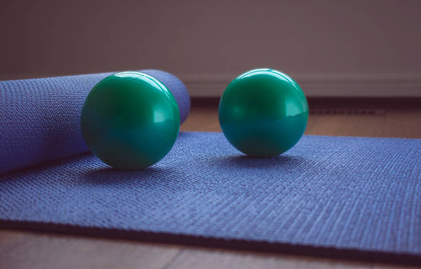 istock Yoga mat and balls with pastel background 1142272673