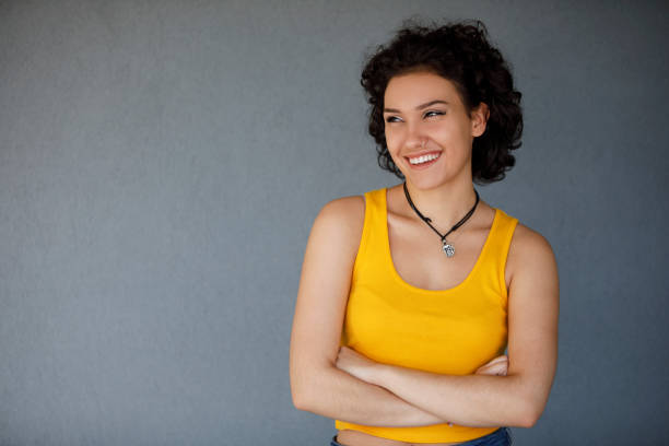 istock Cute young woman looking away and smiling 1142273747
