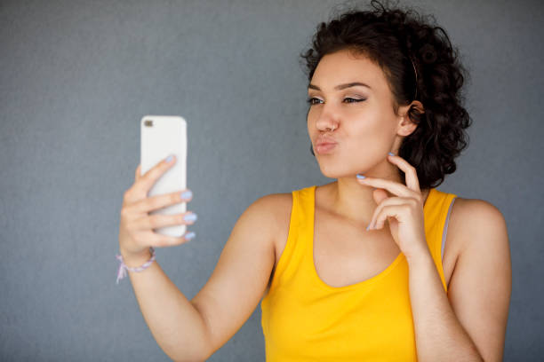 istock Young woman making selfie 1142273935