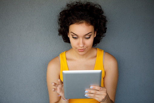 Young attractive woman with digital tablet