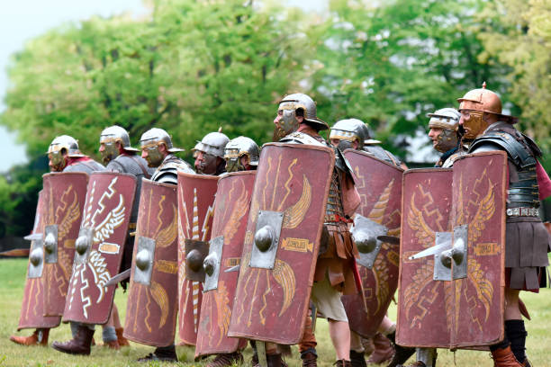 ancient Roman legion Gessate, Milan, Italy: April 07, 2019: reenactment of Roman legionary during battle against Gallic army and life scene in war training camp like dueling reenactment stock pictures, royalty-free photos & images