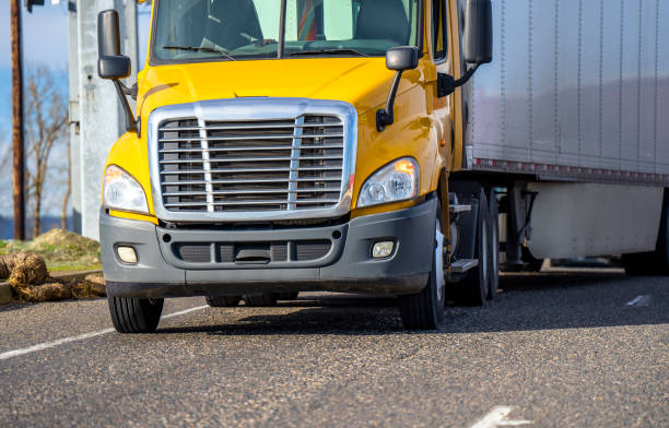 istock Yellow big rig day cab semi truck with semi trailer turning on the highway exit 1142277430