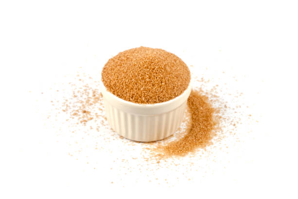 istock Brown cane sugar in ceramic bowl isolated on white background. 1142281514