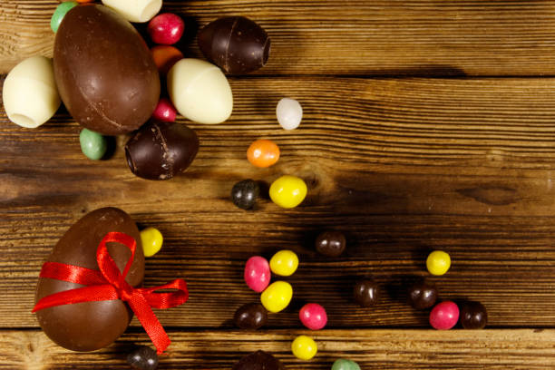 istock Easter composition with chocolate eggs on wooden background 1142282508