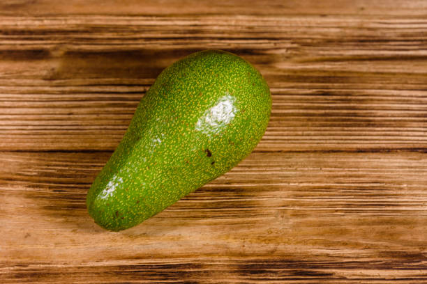 istock Ripe avocado fruit on a wooden table 1142283961