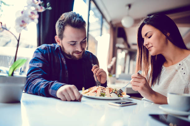 istock Couple Enjoying Caesar  Salad Together 1142284918