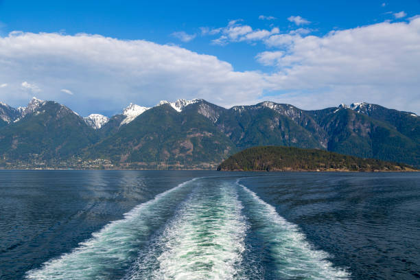 Ship Wake Coast Mountains Wake in Howe Sound from behind a BC Ferry traveling from Horseshoe Bay to Langdale on the Sunshine Coast, British Columbia, Canada. west vancouver stock pictures, royalty-free photos & images
