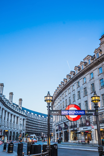 View of Regent Street and the entrance of Piccadilly tube station with copy space in the sky. Regent Street is a major shopping street in the West End of London.