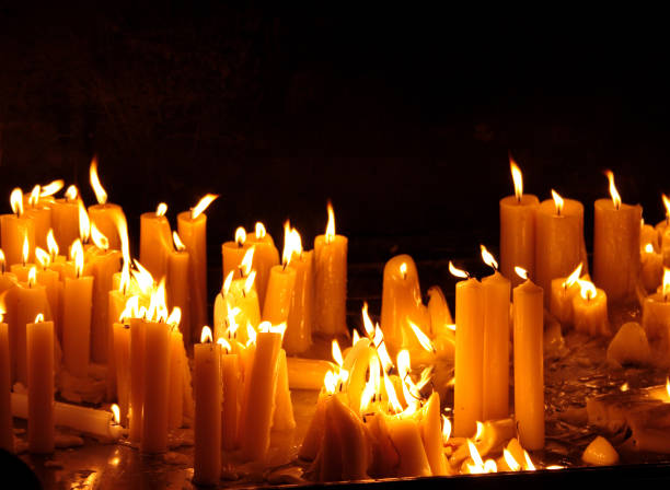 istock Many burning candles with shallow depth of field 1142298027