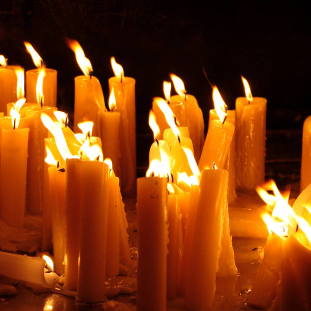 istock Many burning candles with shallow depth of field 1142298032