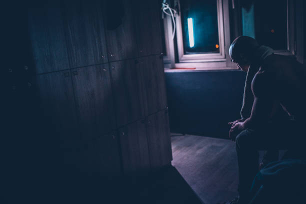 istock Tired man sitting at the locker room 1142301384