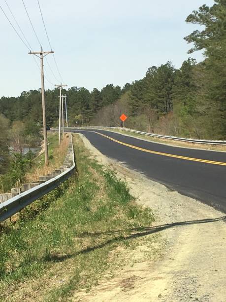 istock Country Road with Bridge 1142304026