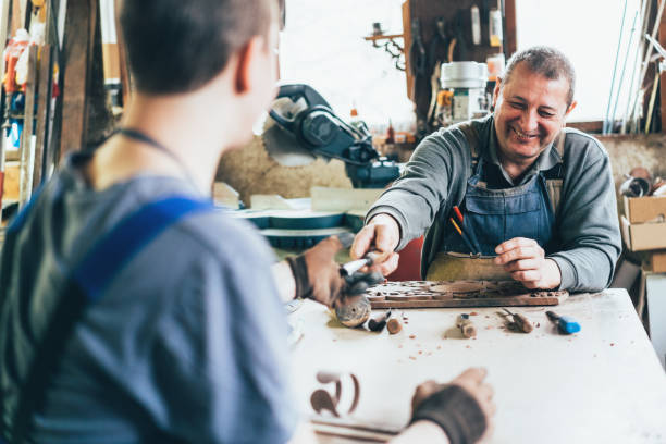 istock Father and son carpenters 1142304038