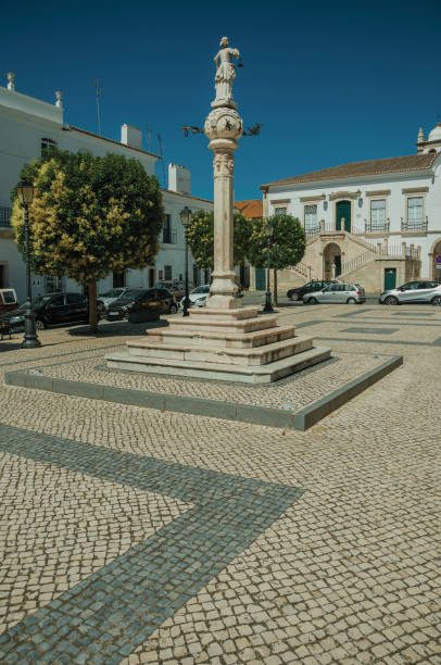 istock Marble pillory in deserted square with old buildings 1142312134