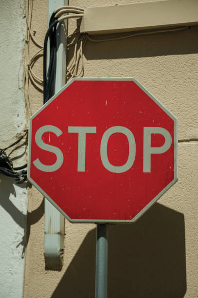 istock NO ENTRY road sign in front of rough plaster wall 1142317056