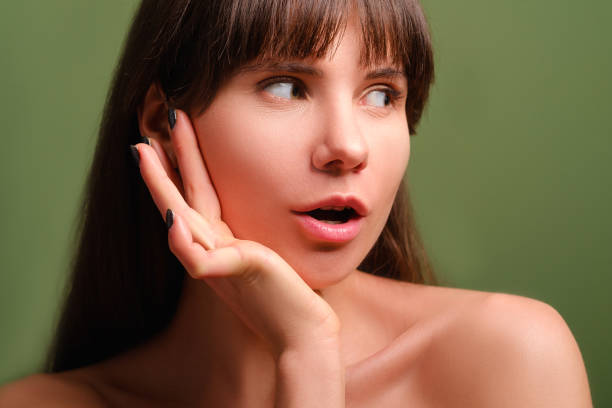 istock surprised amazed beautiful girl portrait 1142322845