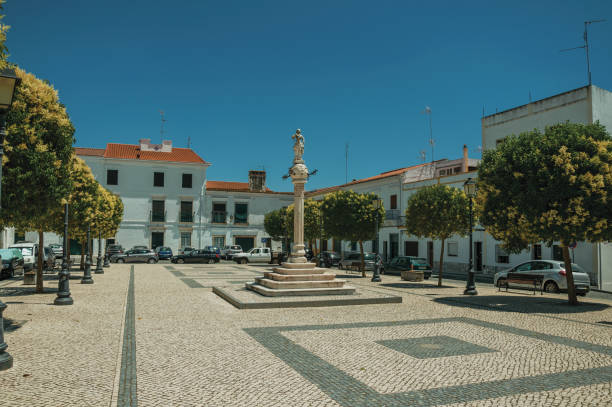 istock Marble pillory and sculpture on top in square with old building 1142323648