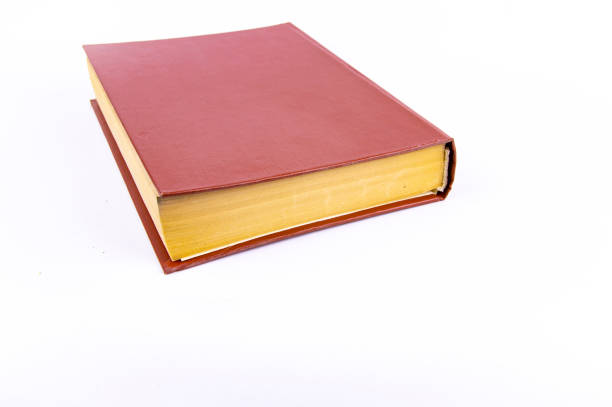 istock Old books with yellow pages on a white background 1142329269