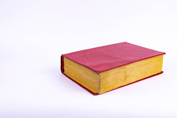 istock Old books with yellow pages on a white background 1142329273