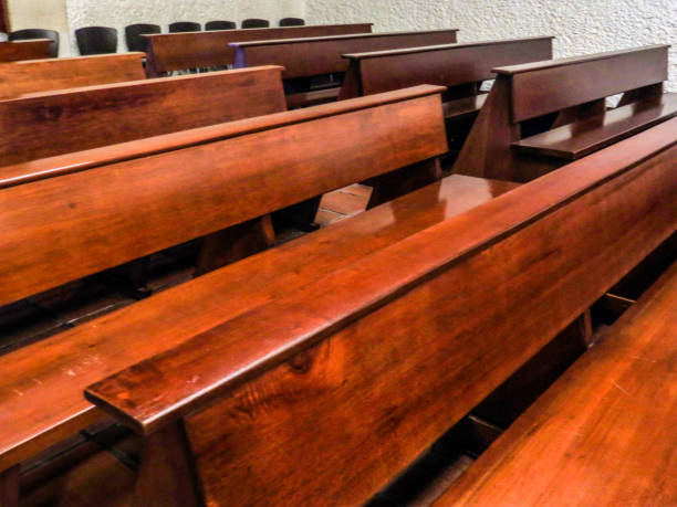 istock Church benchs in line 1142329354
