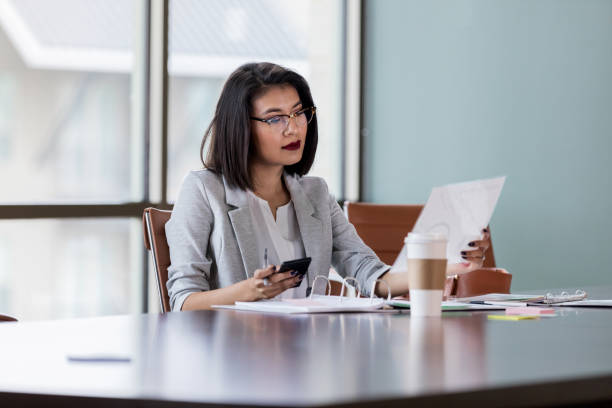 Young businesswoman reads paperwork