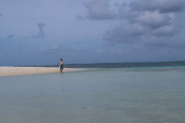 istock Woman standing at the water 1142343005