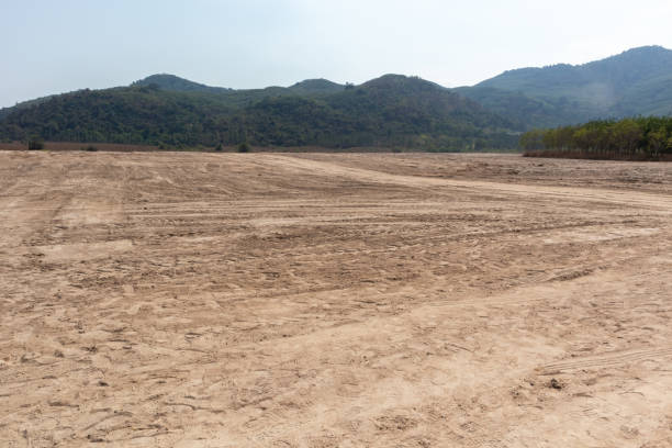 istock empty dirt field on sunny day at Thailand 1142343972
