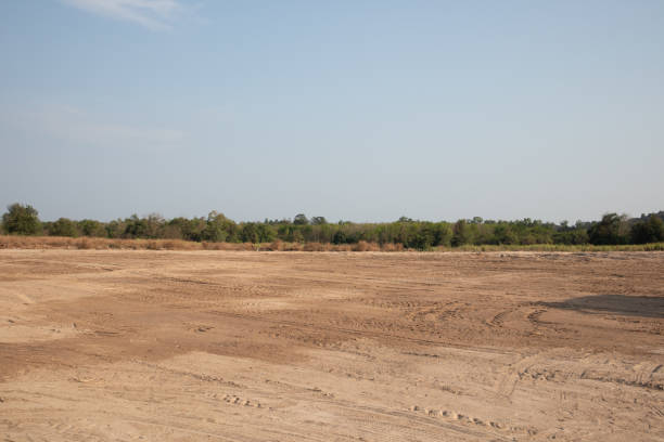 istock empty dirt field on sunny day at Thailand 1142344006