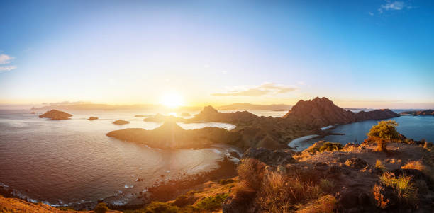 Panoramic scenic view of Padar Island. Komodo National Park, Indonesia. Panoramic scenic view of Padar Island during sunset with dramatic sky, Palau Padar, Komodo National Park, Indonesia pulau komodo stock pictures, royalty-free photos & images