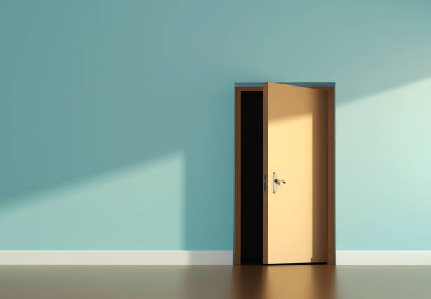 istock Sunlit room and open door 1142352074