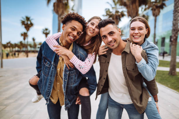 istock friends piggyback in barcelona 1142354852