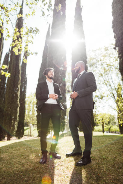 istock business man talking together in the park 1142354993