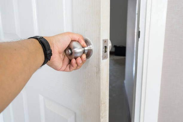 istock left hand of man hold and open white door to exit the room 1142355396