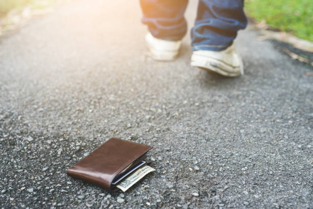 istock Wallet on the floor.Man lost his wallet 1142360984