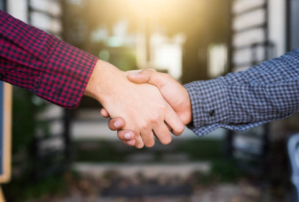 istock Closeup of people shaking hands 1142361135