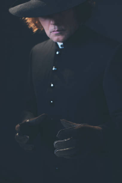 istock Victorian man in hat with hands in gloves. 1142361815