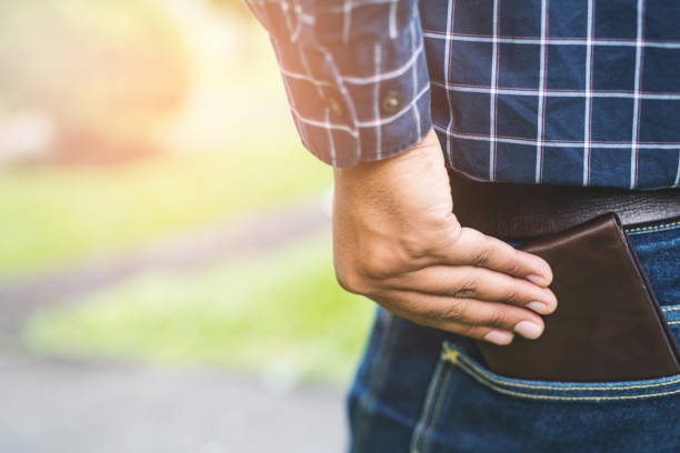 istock Man putting his wallet in back pocket 1142362574