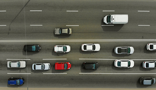 City traffic on a highway, top view, aerial from drone