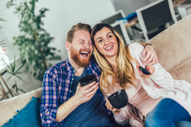 istock Couple in love sitting on the sofa, having fun. 1142363071