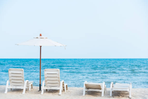 istock White beach chair on the tropical beach 1142363096
