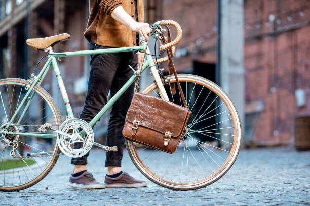 Man with retro bicycle and bag outdoors, cropped image with no face