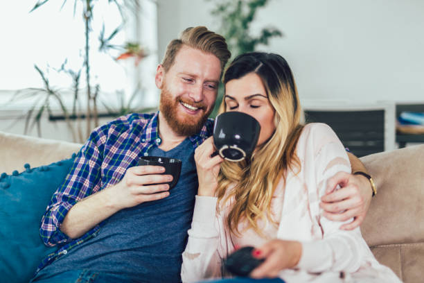 istock Couple in love sitting on the sofa, having fun. 1142364178