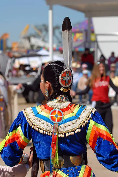 Color picture of an American indian girl from behind