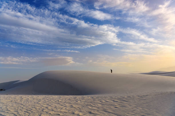 istock Hiking on the desert sand at sunset 1142365531