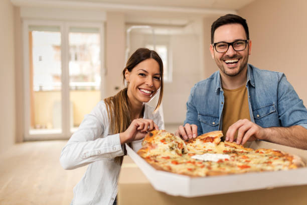 istock Couple enjoying delicious pizza 1142365643
