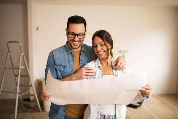 istock Couple decorating new home 1142365647