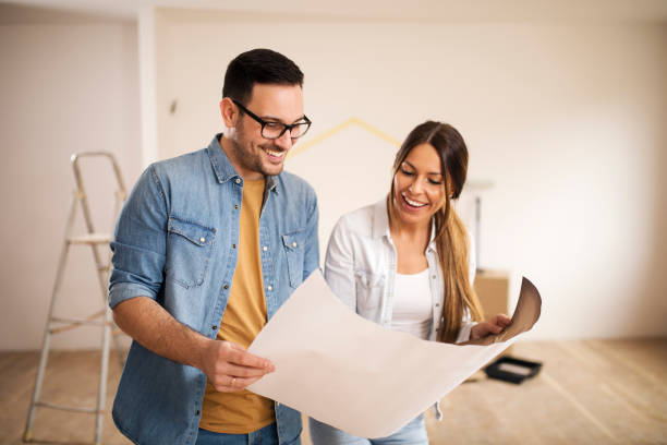 istock Couple looking at the blueprints 1142365735
